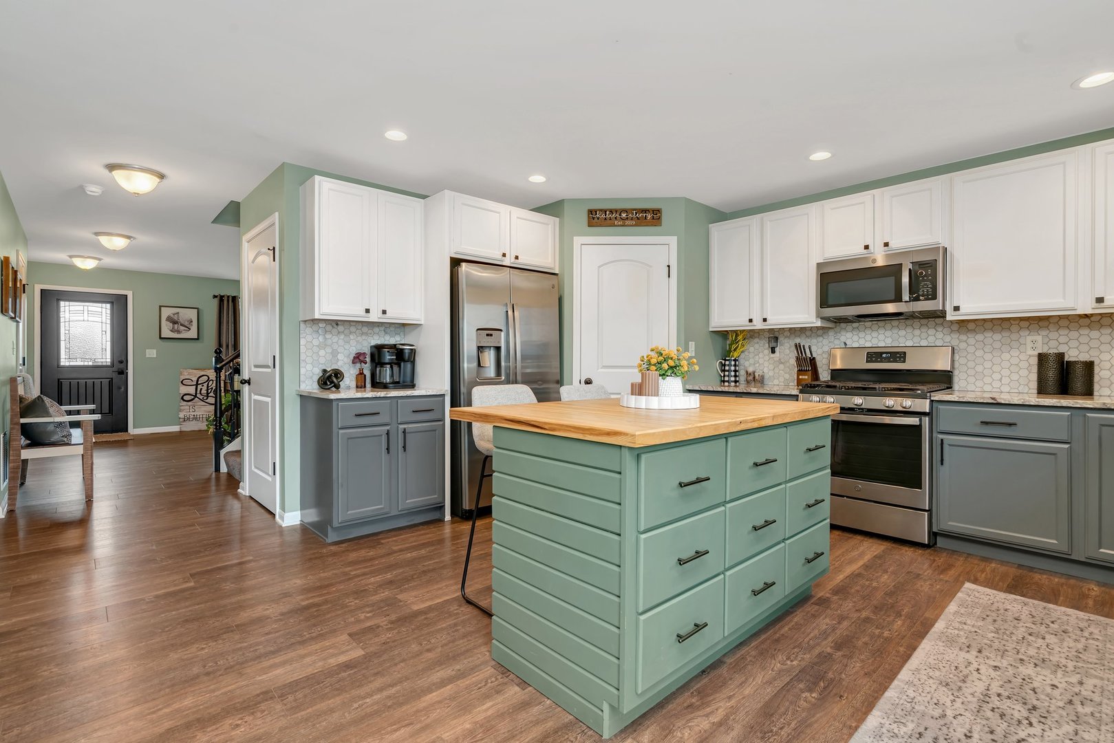 1901 Locust Road Morris, IL 60450 - Photo 7 of 30 a kitchen with stainless steel appliances kitchen island wooden cabinets and a refrigerator