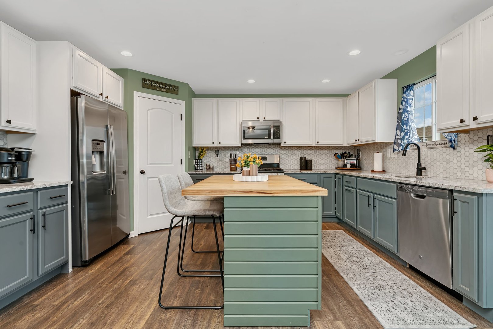 1901 Locust Road Morris, IL 60450 - Photo 8 of 30 a kitchen with kitchen island a sink stainless steel appliances and cabinets