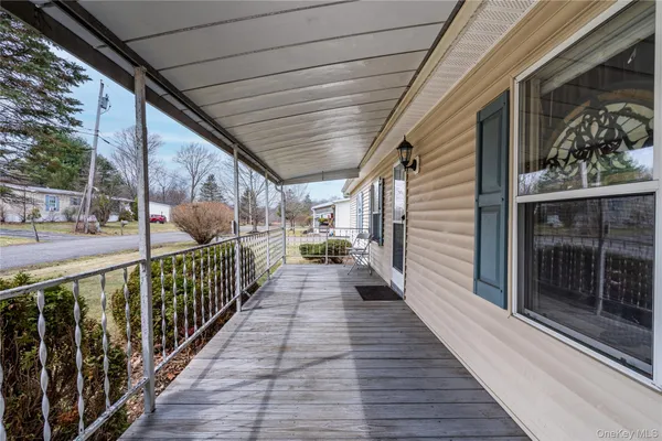 a front view of house with yard and trees