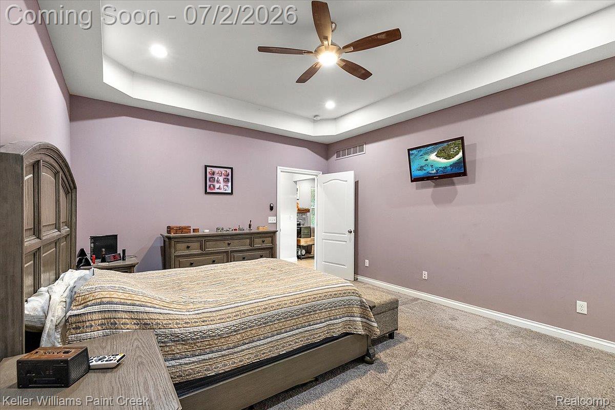 54230 Card Road Macomb, MI 48042 - Photo 49 of 73 Carpeted room featuring a tray ceiling with recessed lighting and a ceiling fan