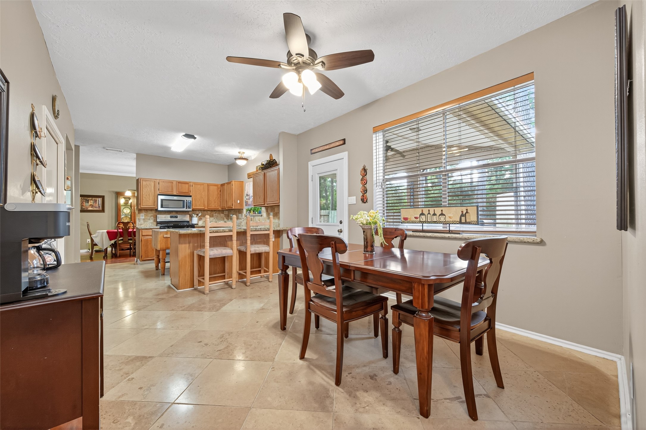 17215 Chaseloch Street Spring, TX 77379 - Photo 19 of 32 a view of a dining area with furniture and a large window