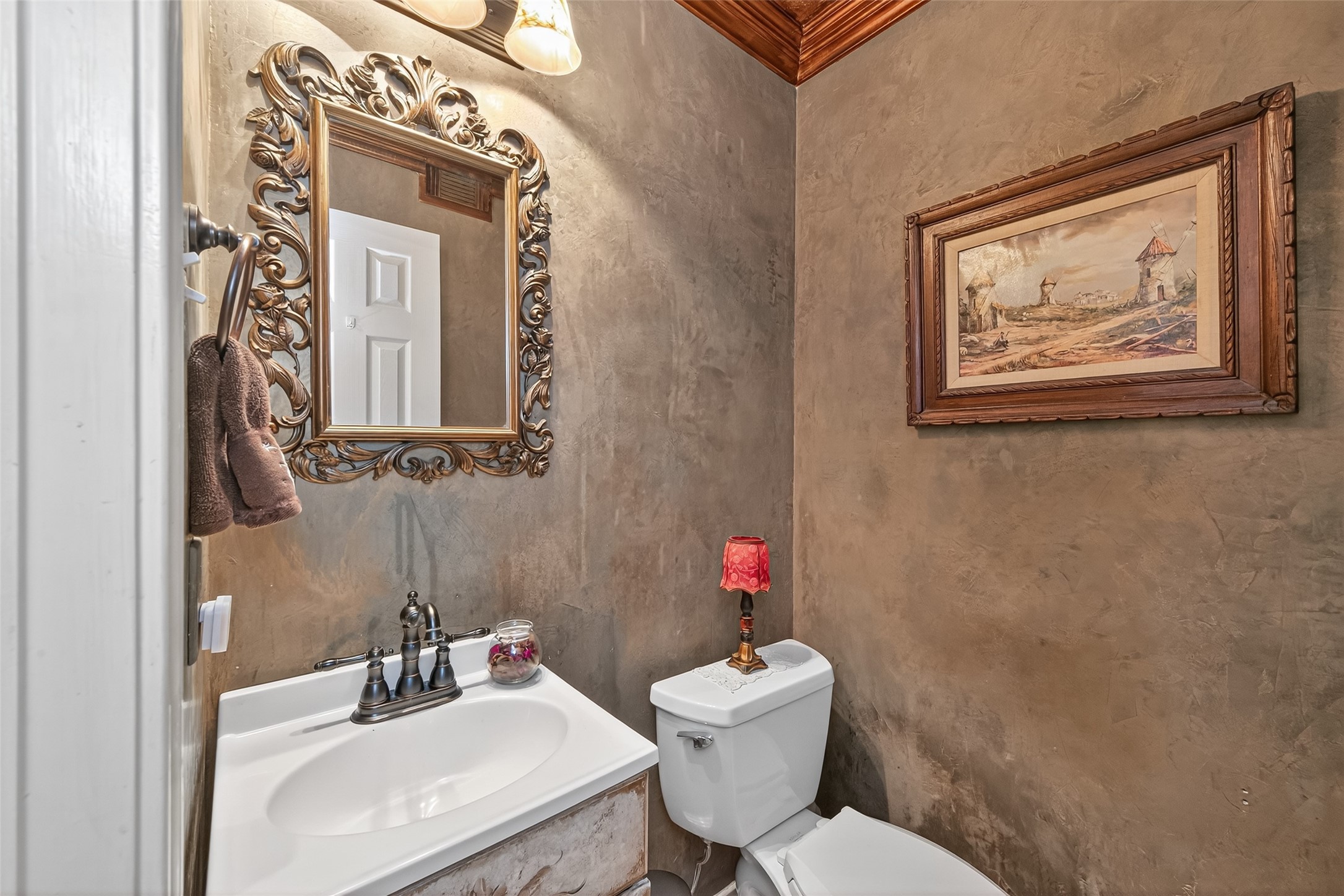17215 Chaseloch Street Spring, TX 77379 - Photo 20 of 32 a bathroom with a toilet sink and mirror