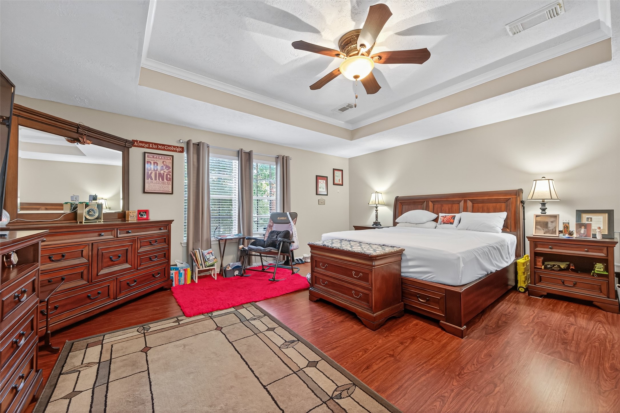 17215 Chaseloch Street Spring, TX 77379 - Photo 28 of 32 a bedroom with a bed ceiling fan and a window
