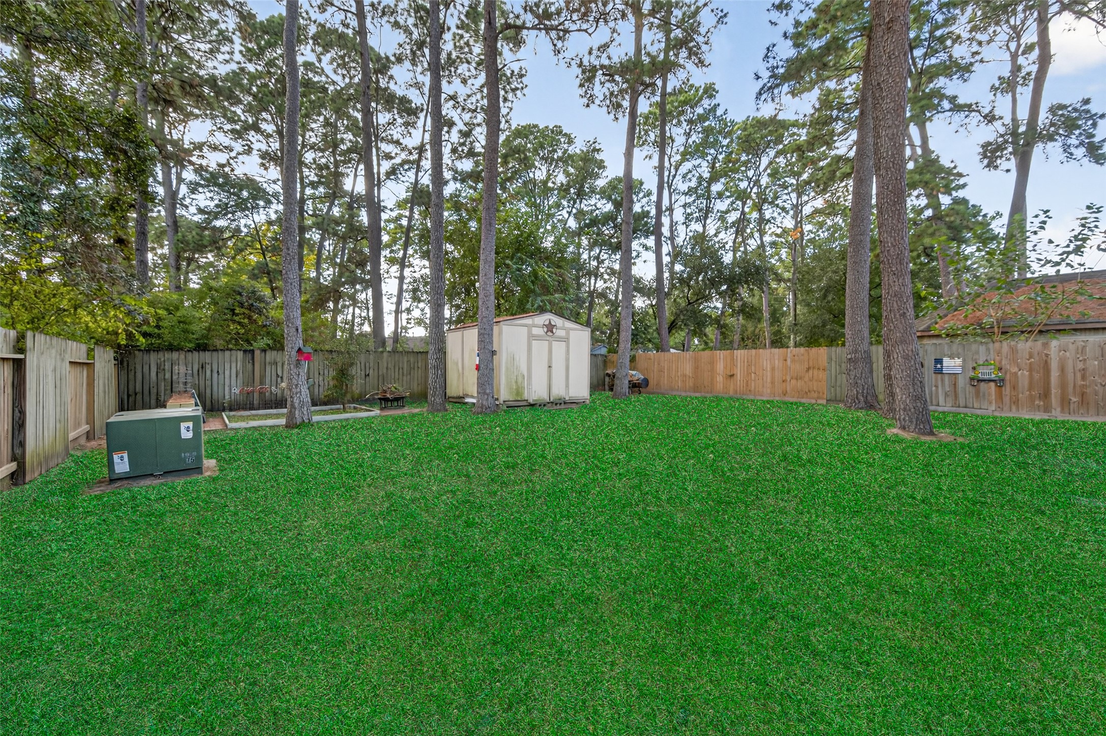 17215 Chaseloch Street Spring, TX 77379 - Photo 32 of 32 a view of a white house with a small yard and a large tree