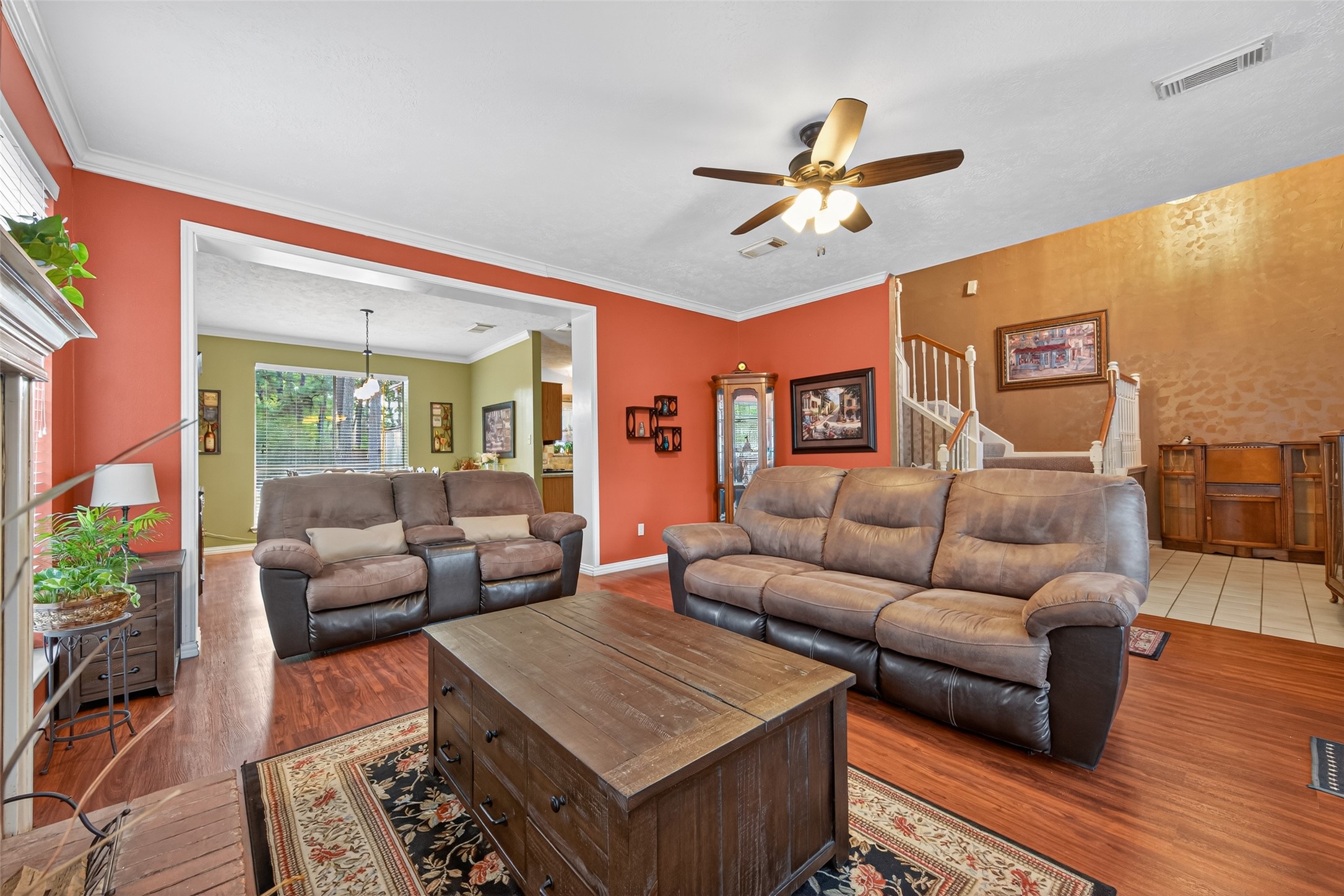 17215 Chaseloch Street Spring, TX 77379 - Photo 7 of 32 a living room with furniture ceiling fan and a rug