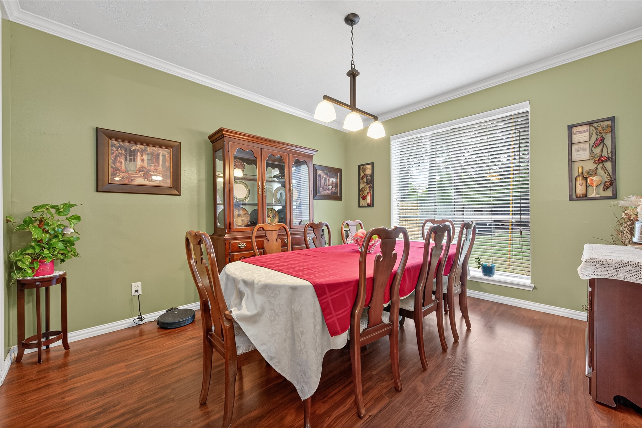 17215 Chaseloch Street Spring, TX 77379 - Photo 9 of 32 a view of a dining room with furniture window and wooden floor