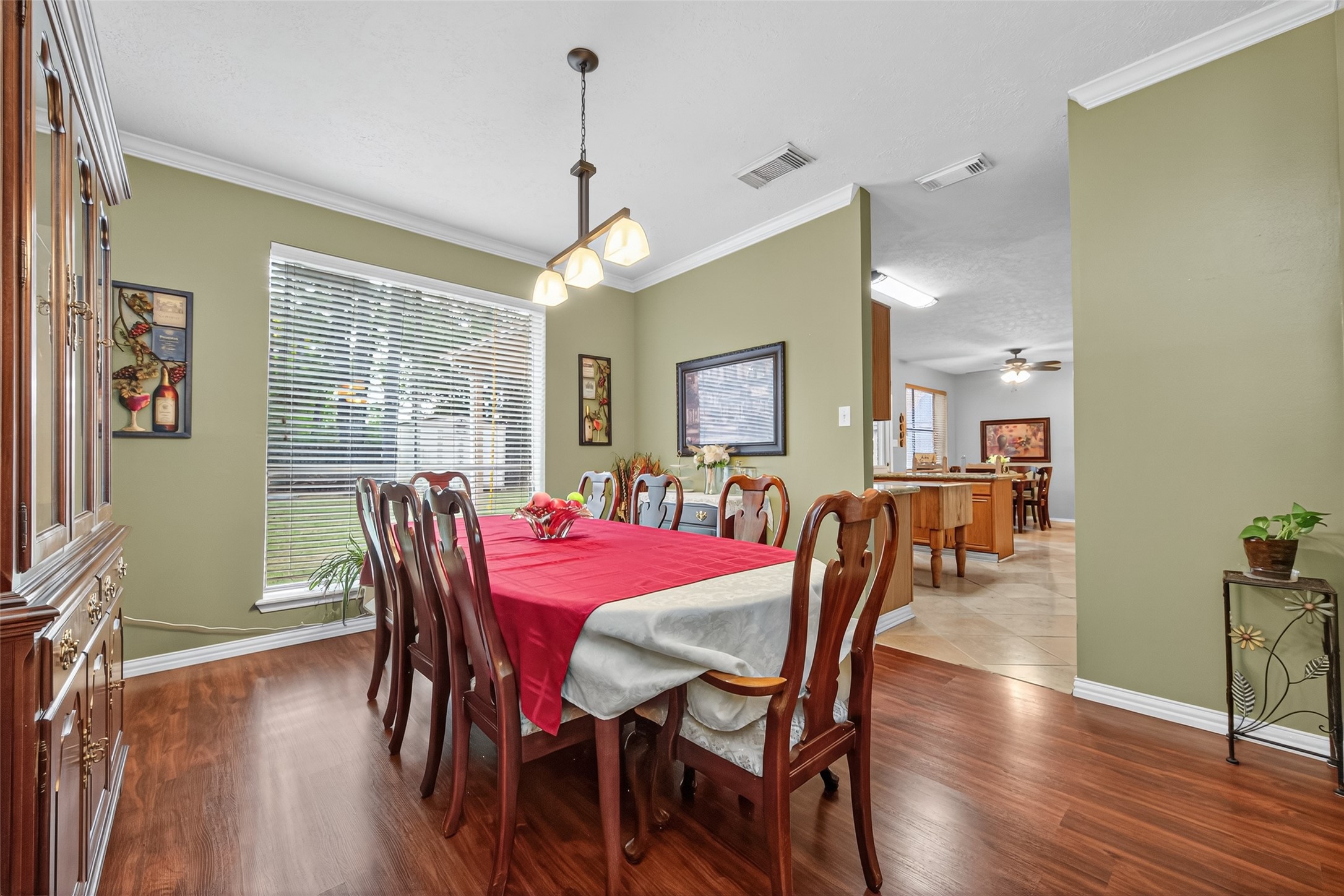17215 Chaseloch Street Spring, TX 77379 - Photo 10 of 32 a view of a dining room with furniture window and wooden floor