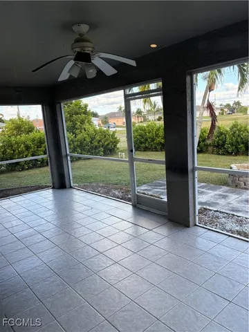 a view of a room with porch and wooden floor
