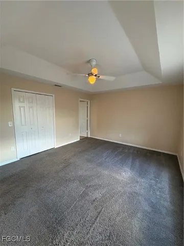 a view of an empty room and a window