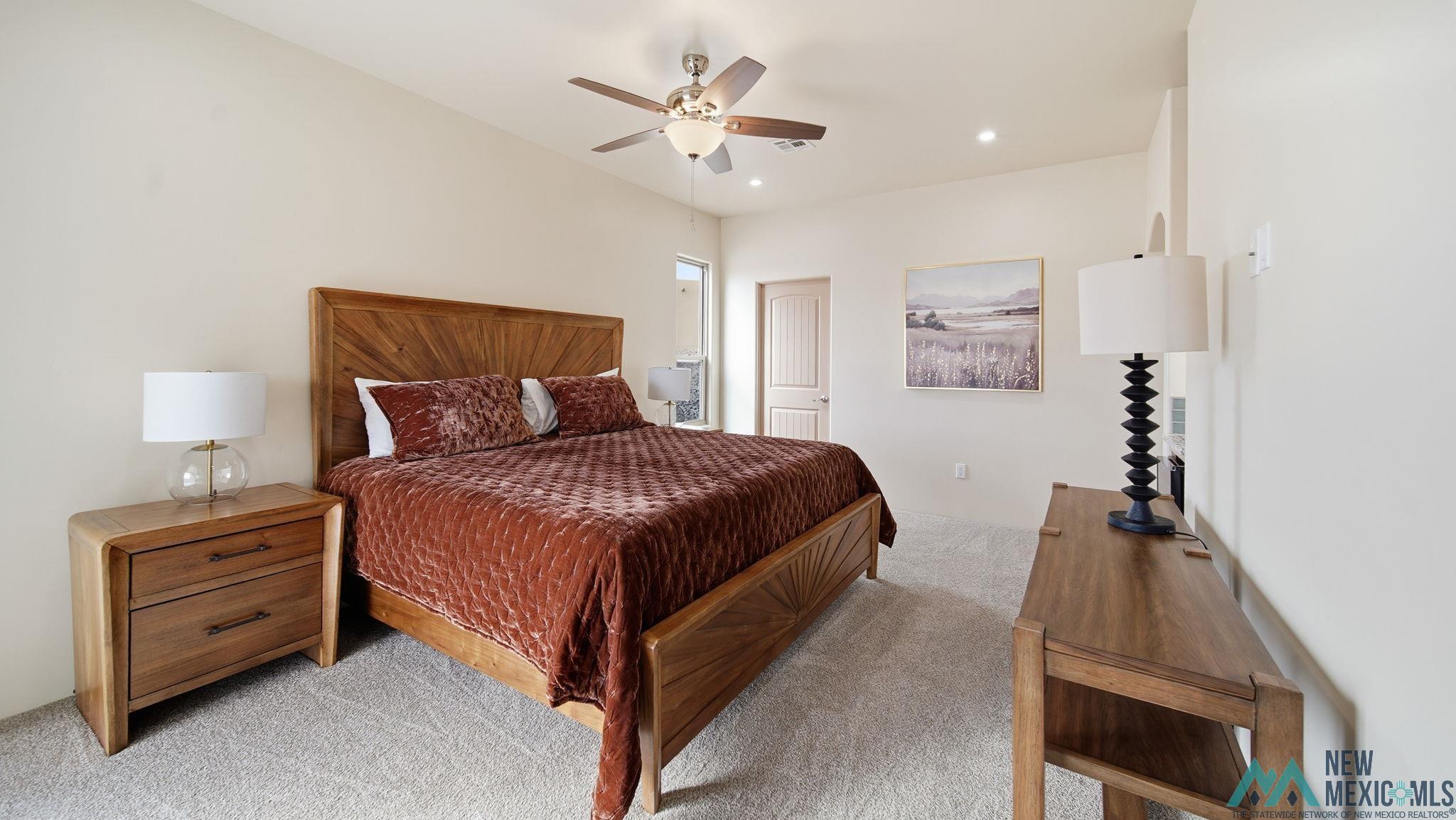 119 Mesa Grande Road Elephant Butte, NM 87935 - Photo 19 of 34 Bedroom with light carpet, ceiling fan, and recessed lighting