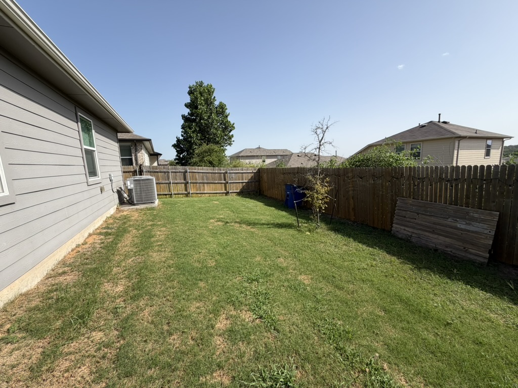 10708 Gonzales Ranger Pass Austin, TX 78754 - Photo 25 of 40 A fully fenced yard offers a private and serene outdoor environment.