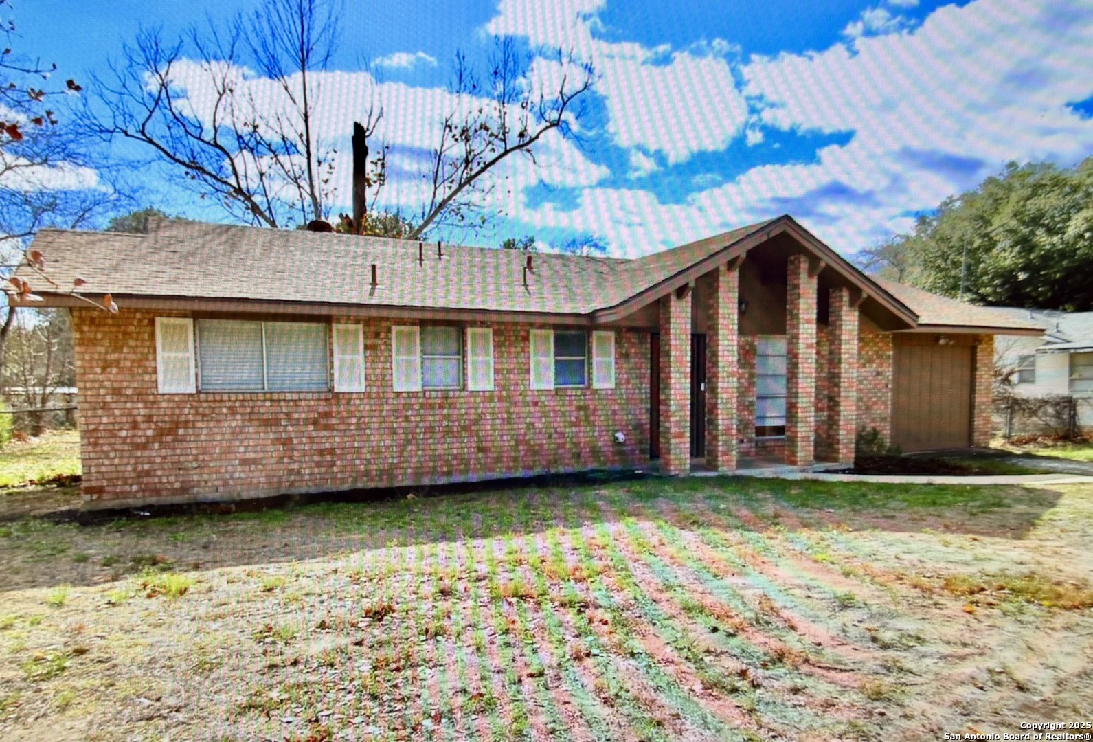 315 Mockingbird Lane Devine, TX 78016 - Photo 2 of 13 a view of a house with a yard