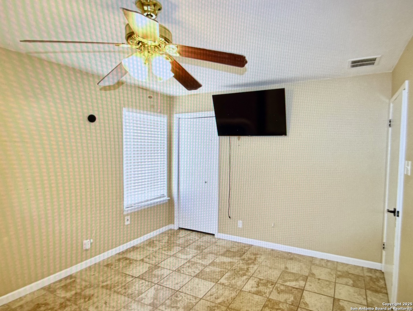 315 Mockingbird Lane Devine, TX 78016 - Photo 7 of 13 a view of a livingroom with a flat screen tv