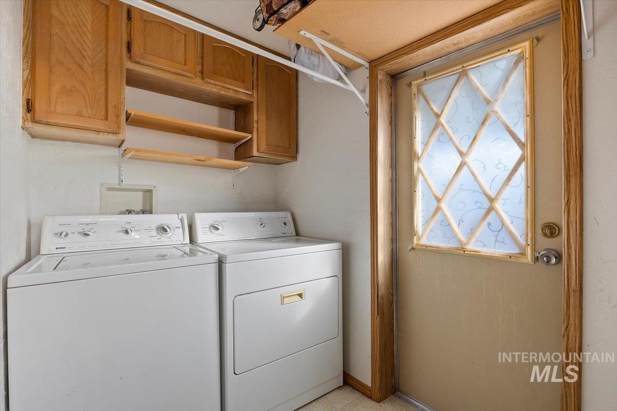 198 South Hills Road, Unit 142 Twin Falls, ID 83301 - Photo 25 of 27 Laundry room featuring cabinet space and separate washer and dryer