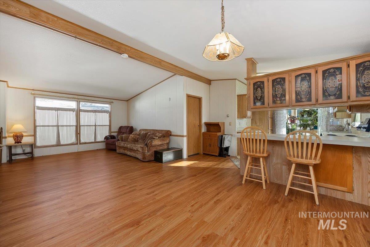 198 South Hills Road, Unit 142 Twin Falls, ID 83301 - Photo 9 of 27 Dining area with light wood-style floors and crown molding