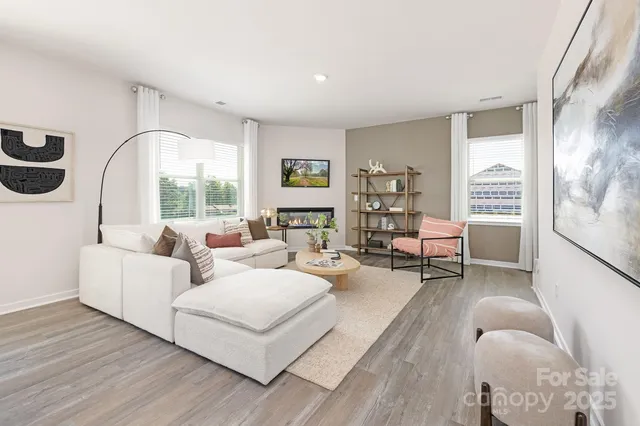 a living room with furniture and a large window