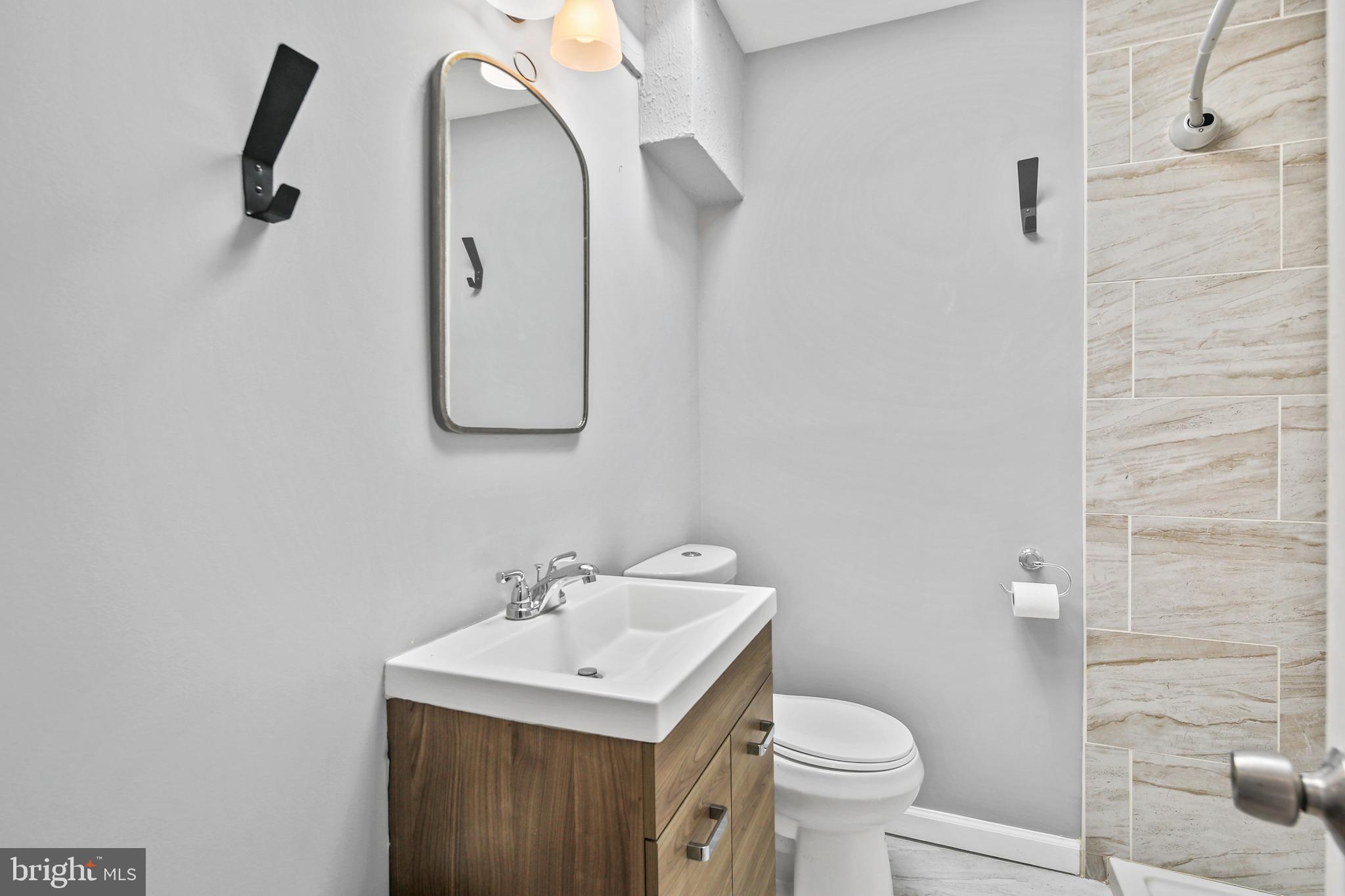 3606 Clarenell Road Baltimore, MD 21229 - Photo 14 of 26 Full Bath with Tile Surround and updated Vanity