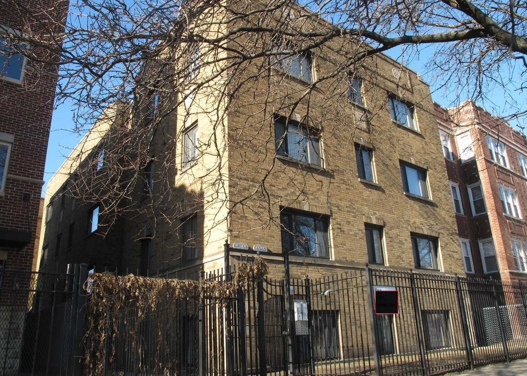 a view of a building with a tree