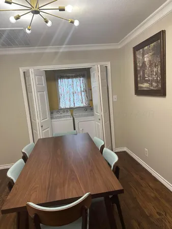 a bedroom with a bed window and couch