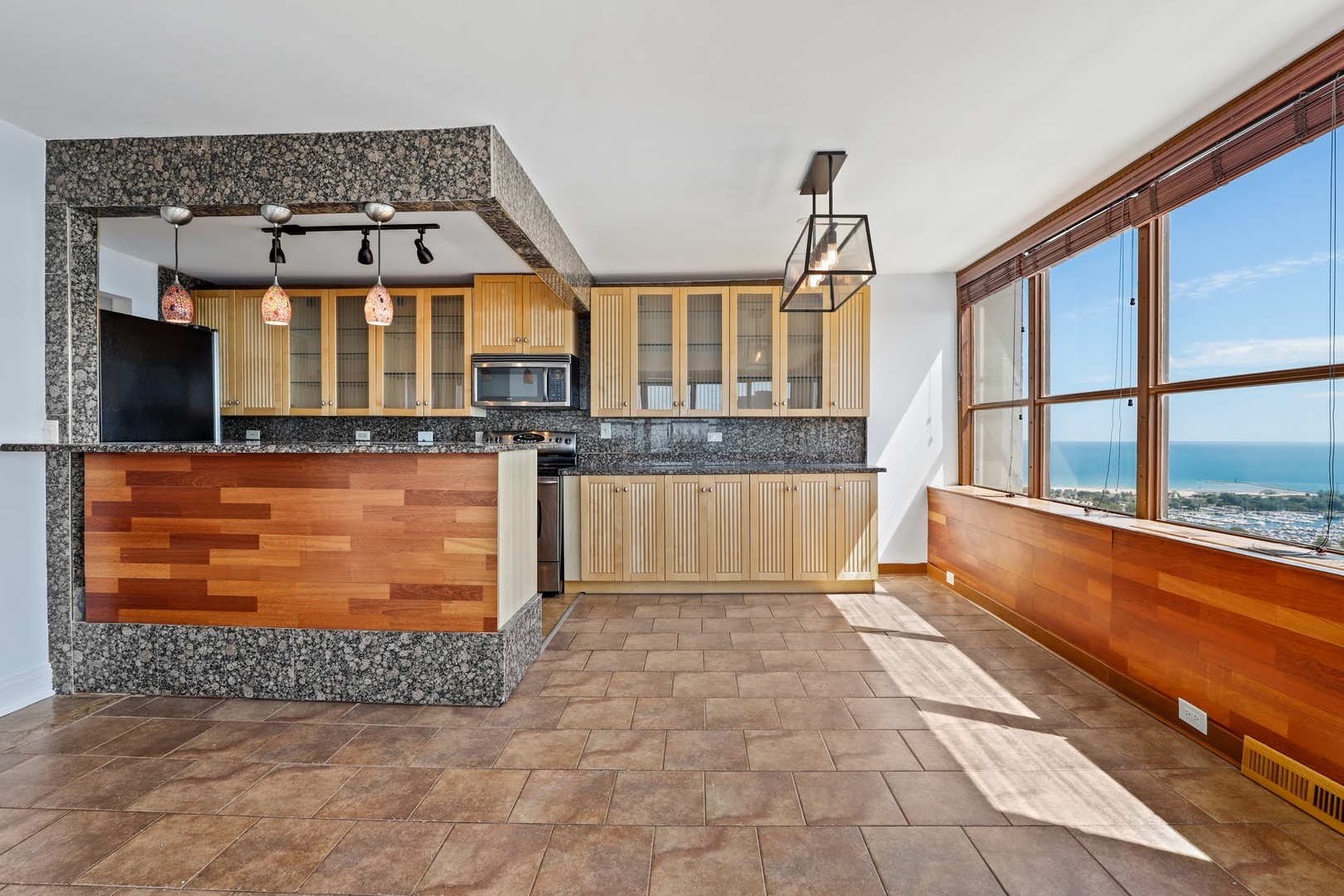 655 West Irving Park Road, Unit 4101 Chicago, IL 60613 - Photo 4 of 13 a view of a kitchen with an outdoor space