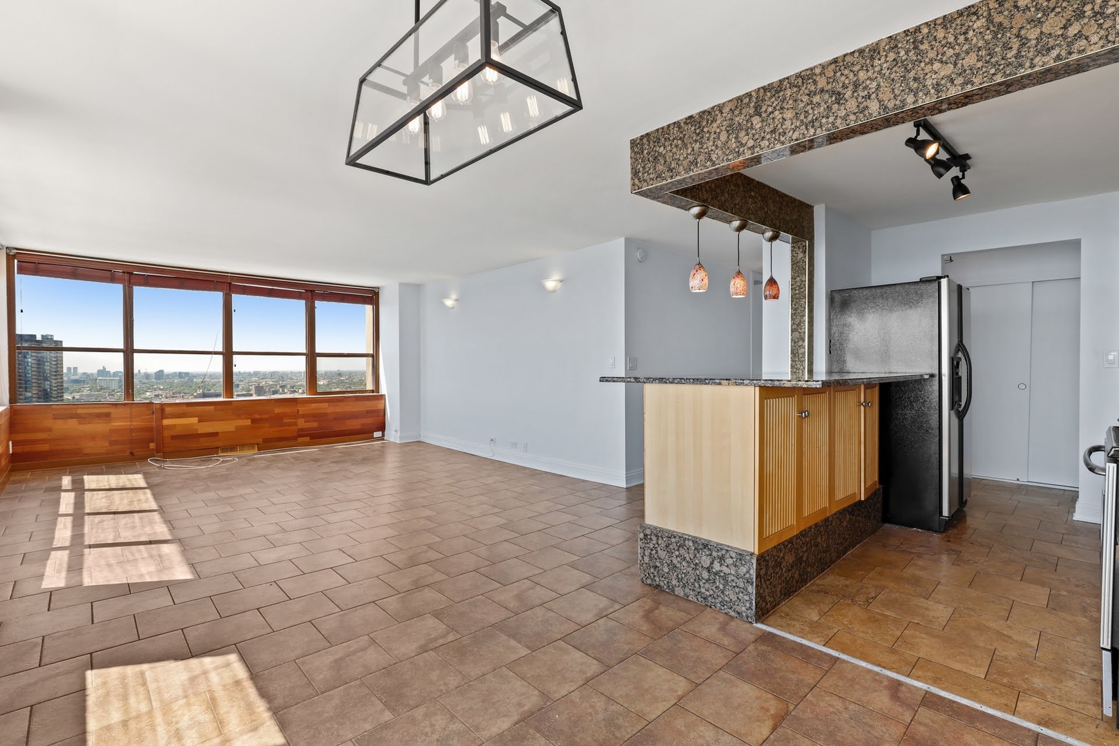 655 West Irving Park Road, Unit 4101 Chicago, IL 60613 - Photo 5 of 13 a view of a living room with a large window