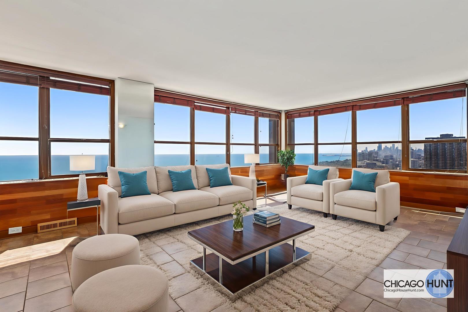 655 West Irving Park Road, Unit 4101 Chicago, IL 60613 - Photo 9 of 13 a living room with furniture and a large window