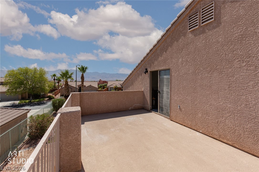 387 Silver Road Mesquite, NV 89027 - Photo 32 of 46 An open stucco balcony provides elevated views of the neighborhood and distant mountains.