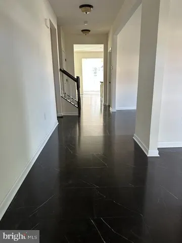 a view of an entryway with wooden floor