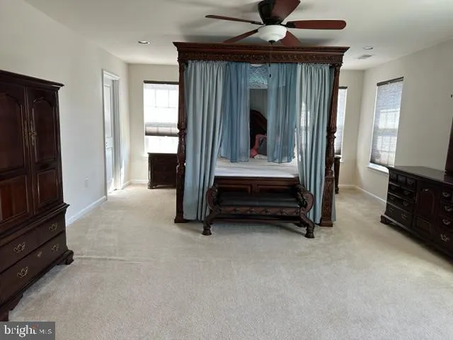 a view of living room with furniture and a flat screen tv