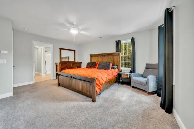 a bedroom with a bed and couch