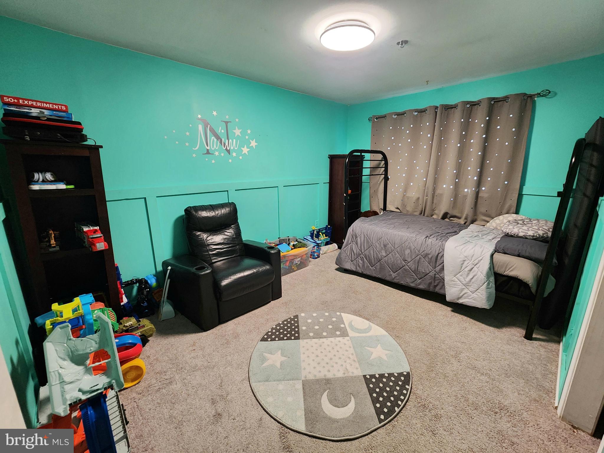 5209 Sumter Court Clinton, MD 20735 - Photo 14 of 24 a bedroom with bed and a mirror