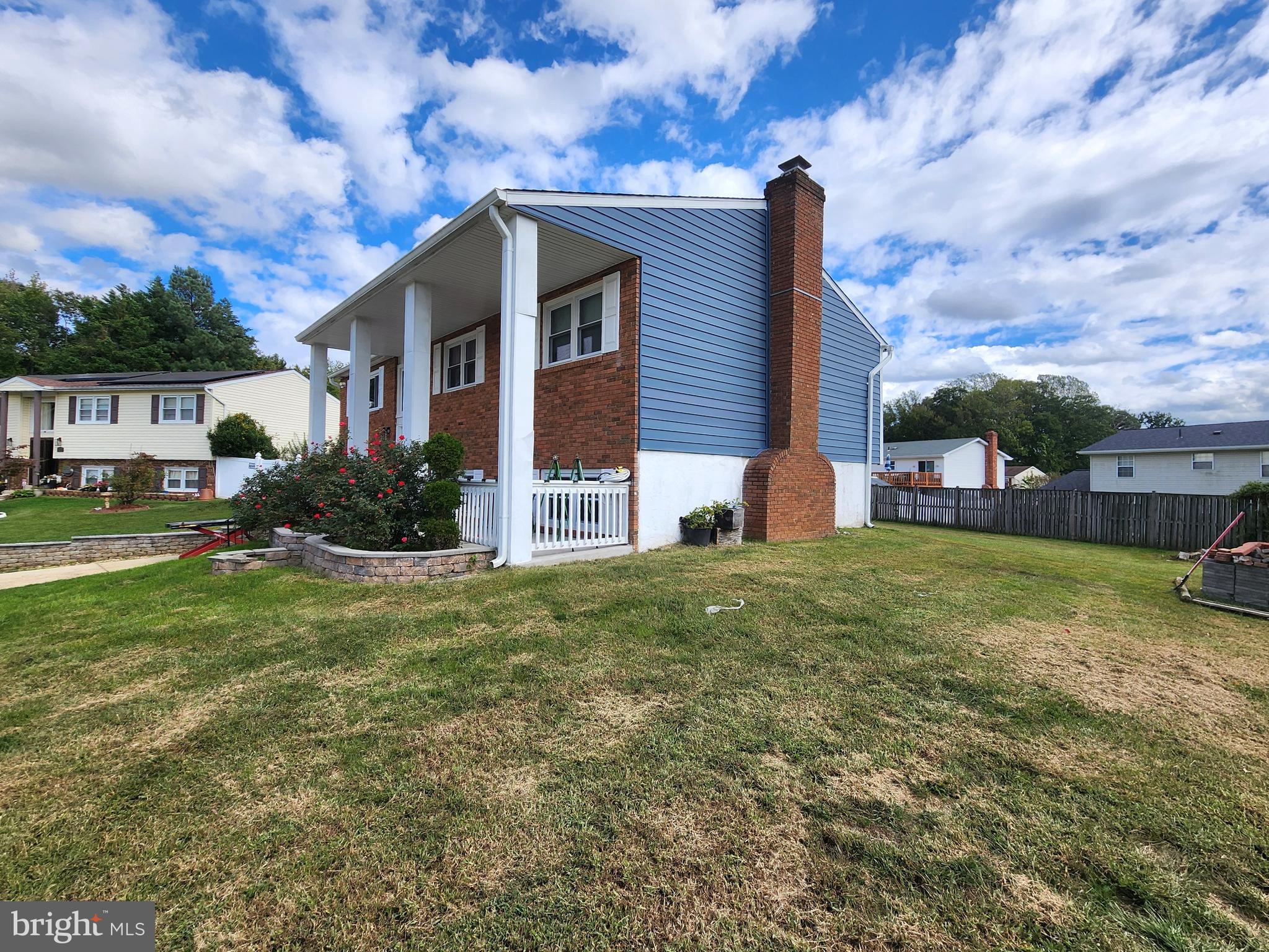 5209 Sumter Court Clinton, MD 20735 - Photo 19 of 24 a front view of house with yard and green space