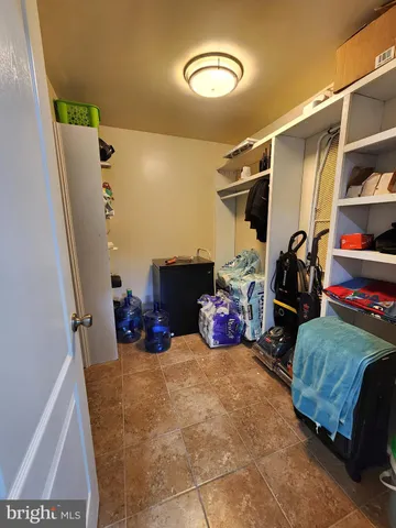 a bedroom with bed and a walk in closet