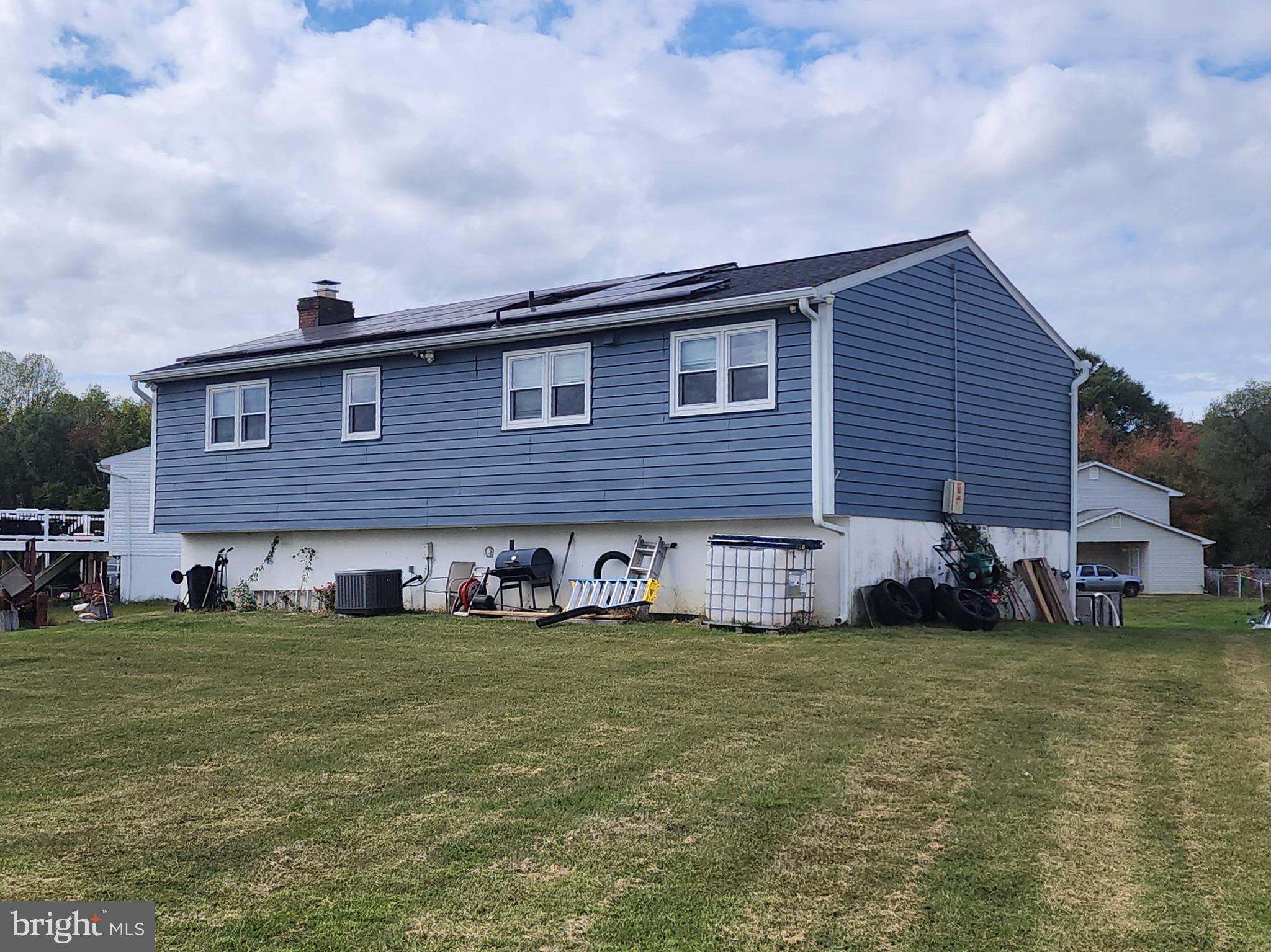 5209 Sumter Court Clinton, MD 20735 - Photo 3 of 25 a large brick building with a big yard