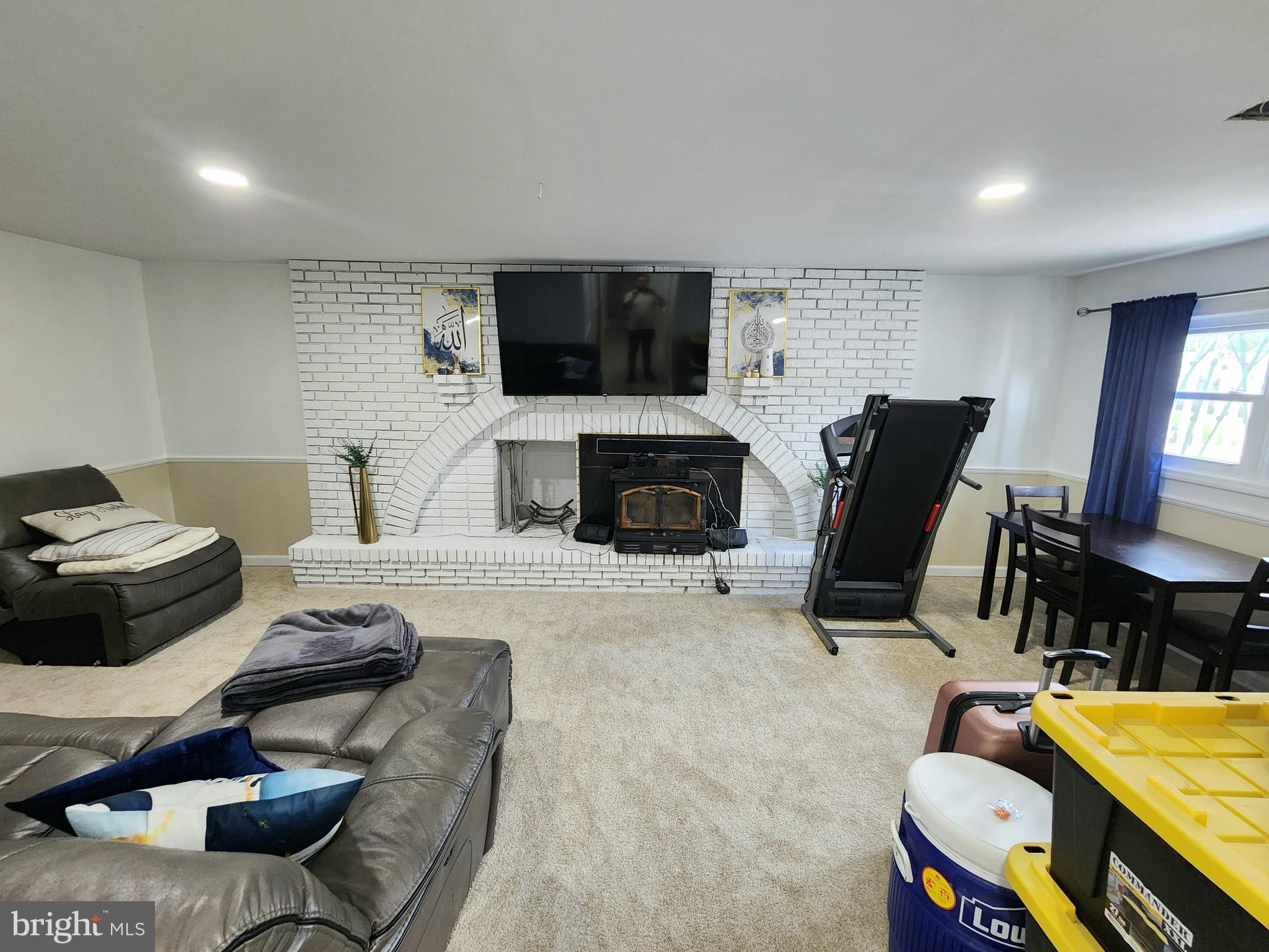 5209 Sumter Court Clinton, MD 20735 - Photo 6 of 24 a living room with furniture a flat screen tv and a fireplace