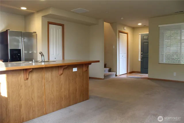 a view of a hallway with windows