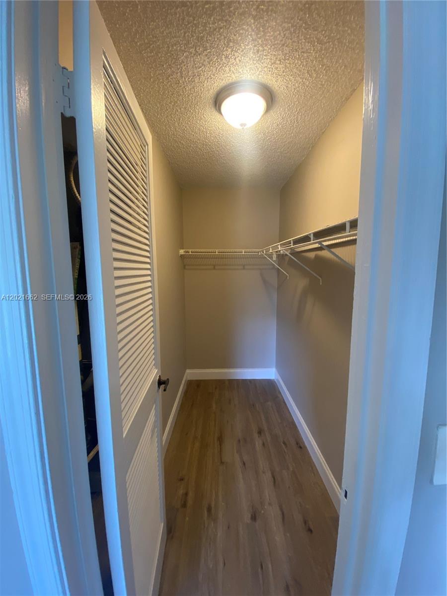 3263 Kirk Road, Unit 2 Lake Worth, FL 33461 - Photo 10 of 14 a view of empty room with wooden floor