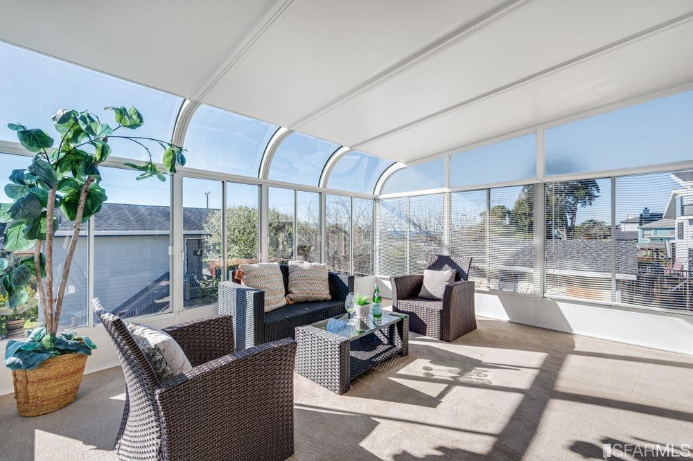 290 Clifton Road Pacifica, CA 94044 - Photo 29 of 60 a living room with patio furniture and a potted plant