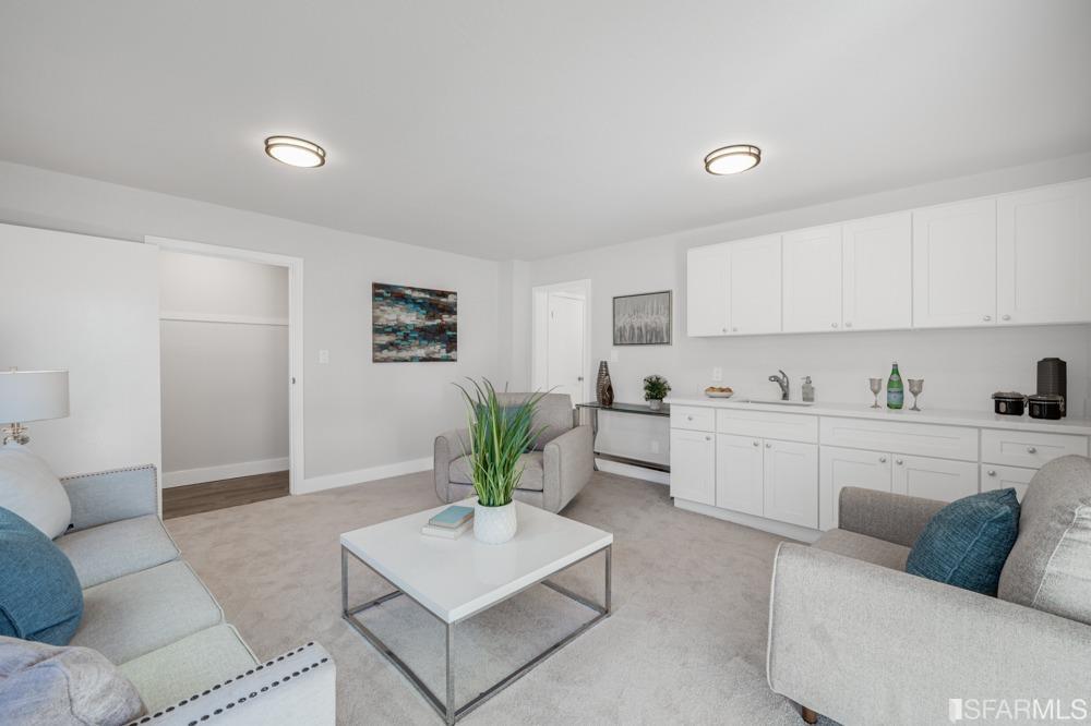 290 Clifton Road Pacifica, CA 94044 - Photo 34 of 60 a living room with furniture kitchen and a potted plant