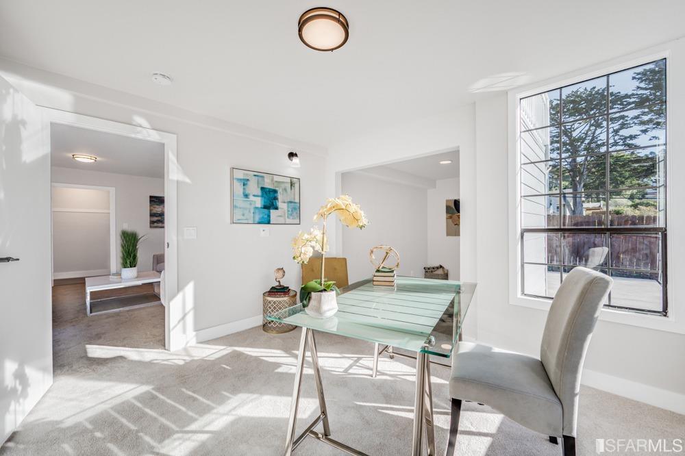 290 Clifton Road Pacifica, CA 94044 - Photo 38 of 60 a view of a dining room with furniture and a large window