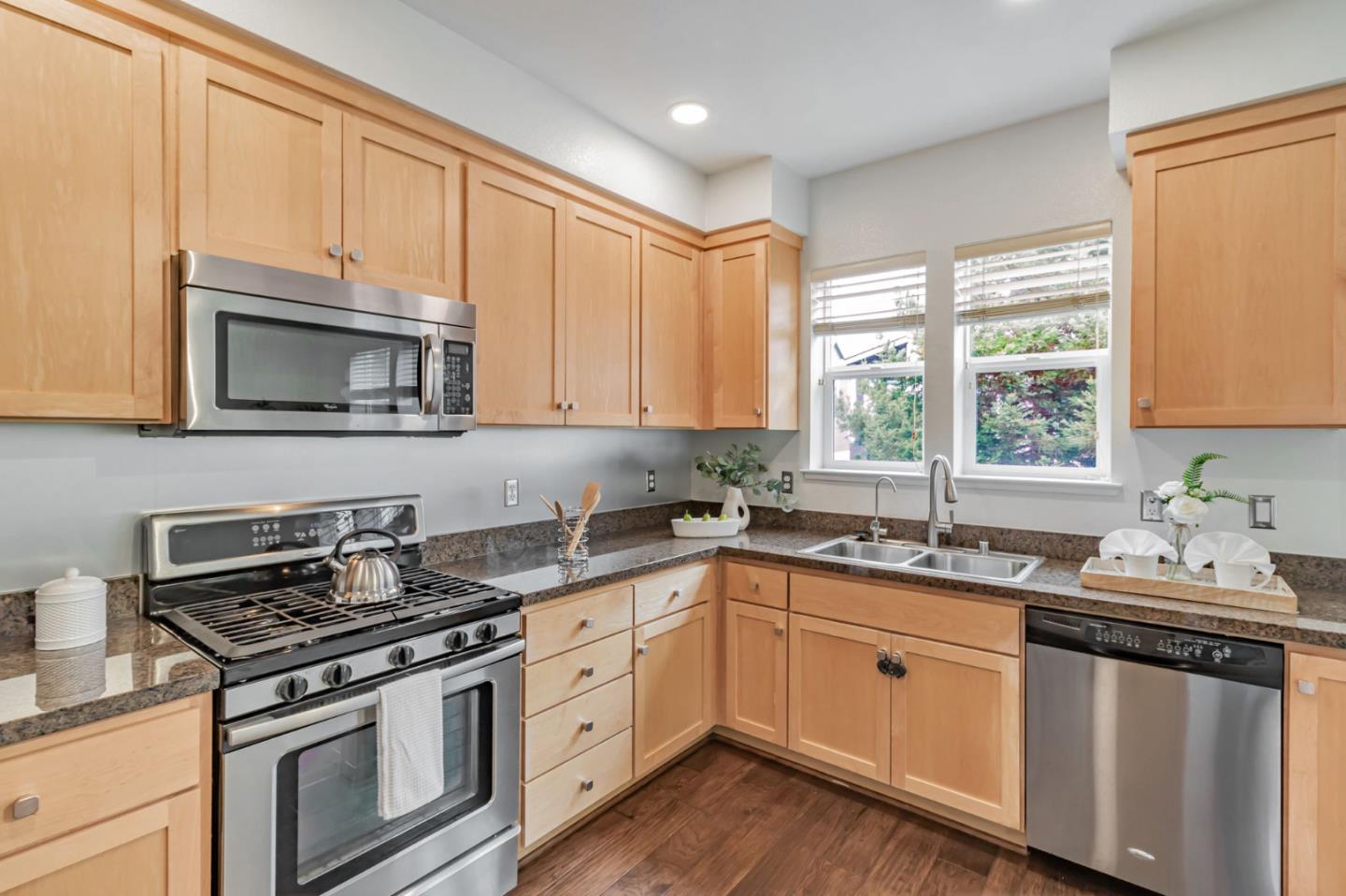 843 Avery Drive Mountain View, CA 94043 - Photo 14 of 43 a kitchen with sink a microwave and cabinets