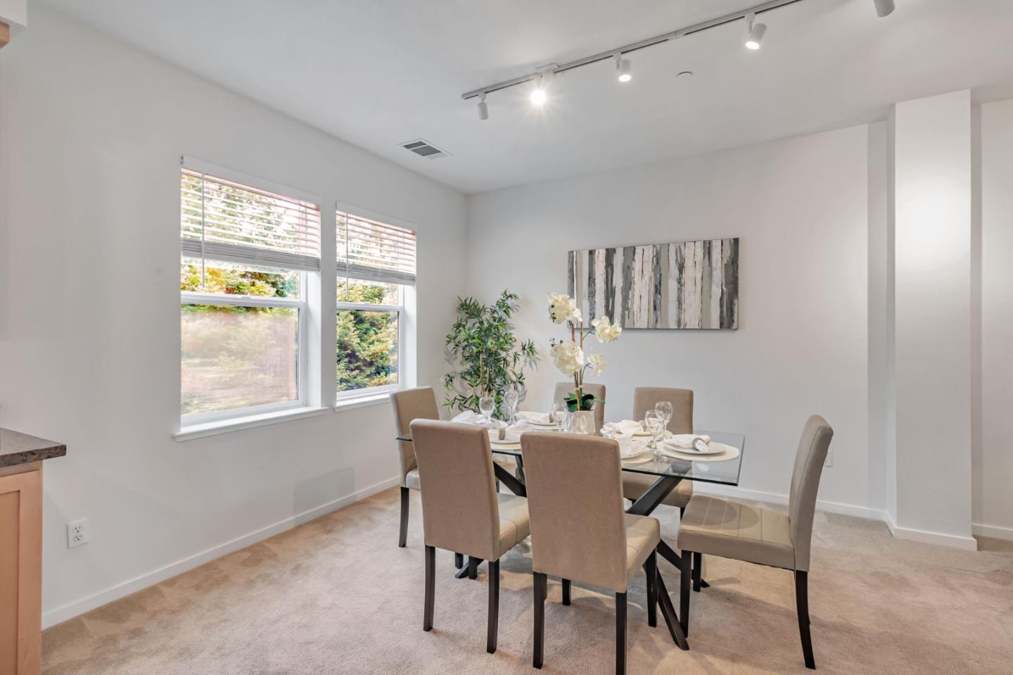 843 Avery Drive Mountain View, CA 94043 - Photo 17 of 43 a view of a dining room with furniture a chandelier and wooden floor