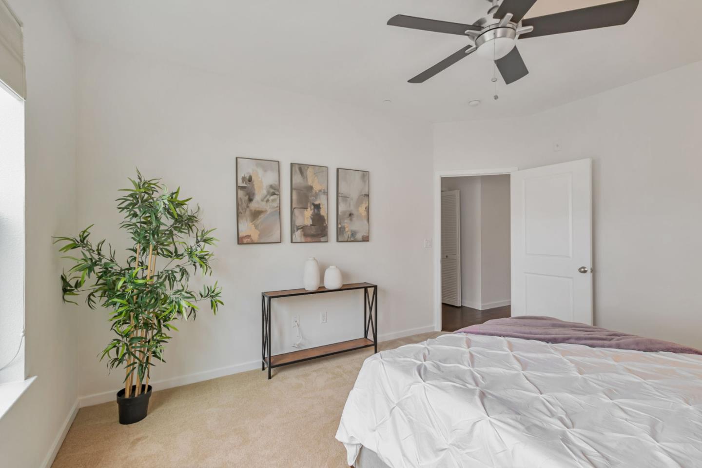 843 Avery Drive Mountain View, CA 94043 - Photo 23 of 43 a bedroom with a large bed and a potted plant