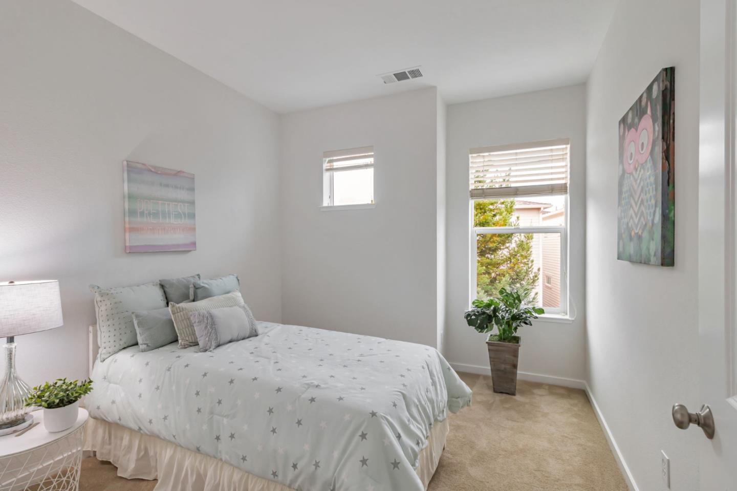 843 Avery Drive Mountain View, CA 94043 - Photo 26 of 43 a bedroom with a bed and a potted plant