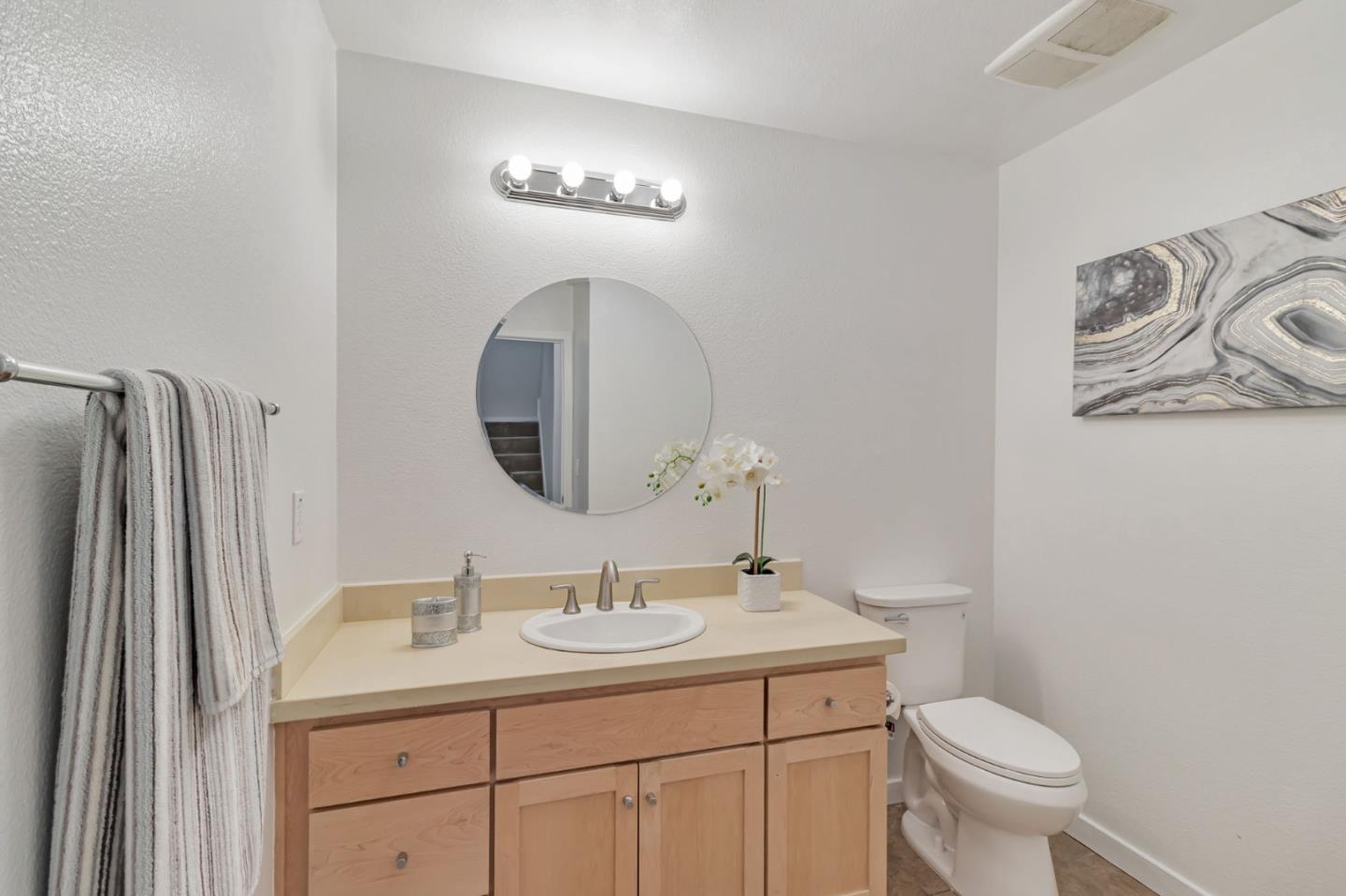 843 Avery Drive Mountain View, CA 94043 - Photo 29 of 43 a bathroom with a toilet sink and mirror