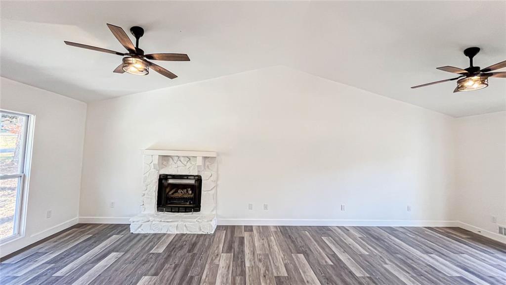 4094 Dollar Circle Suwanee, GA 30024 - Photo 16 of 56 wooden floor in an empty room with a window