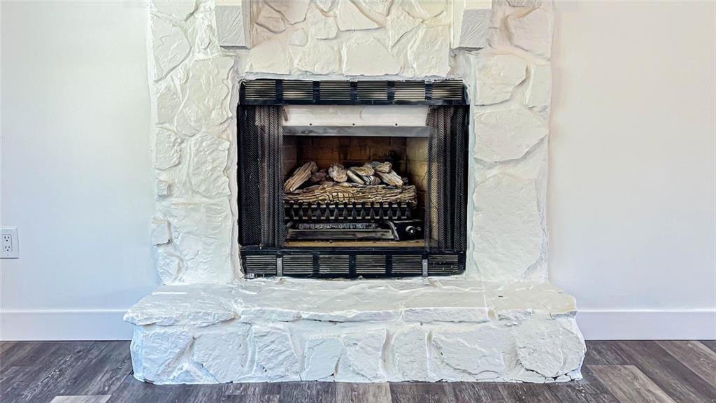 4094 Dollar Circle Suwanee, GA 30024 - Photo 18 of 56 a bed with a fireplace and a potted plant