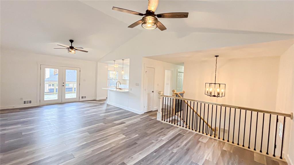 4094 Dollar Circle Suwanee, GA 30024 - Photo 19 of 56 wooden floor in an empty room with a window
