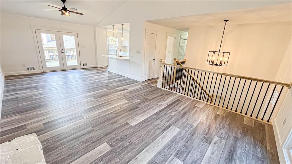 4094 Dollar Circle Suwanee, GA 30024 - Photo 21 of 56 a view of a room with wooden floor