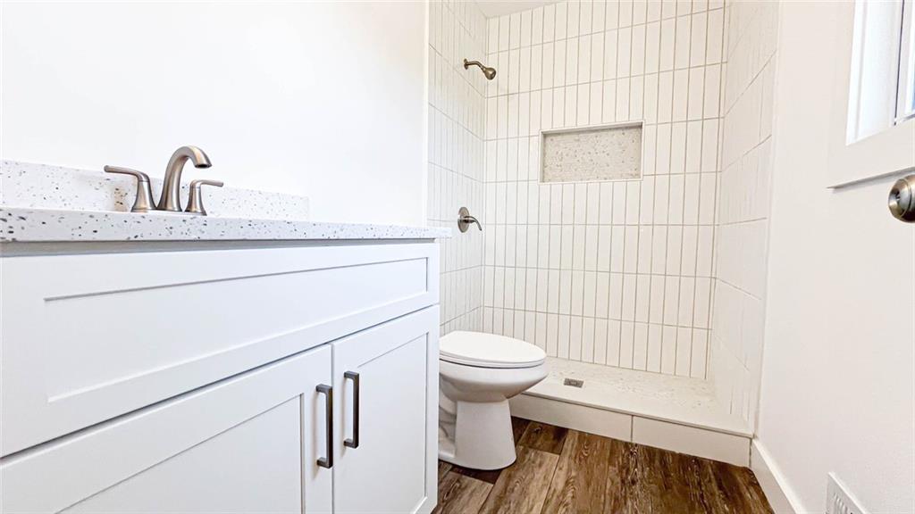 4094 Dollar Circle Suwanee, GA 30024 - Photo 35 of 56 a bathroom with a sink a toilet and shower